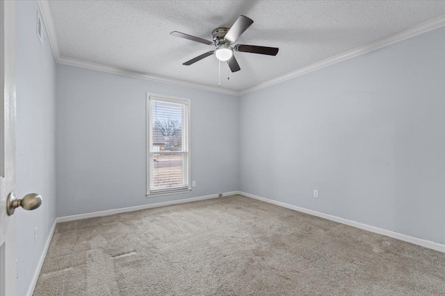 carpeted empty room with ceiling fan, crown molding, and a textured ceiling