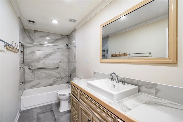 full bathroom featuring vanity, tiled shower / bath, and toilet