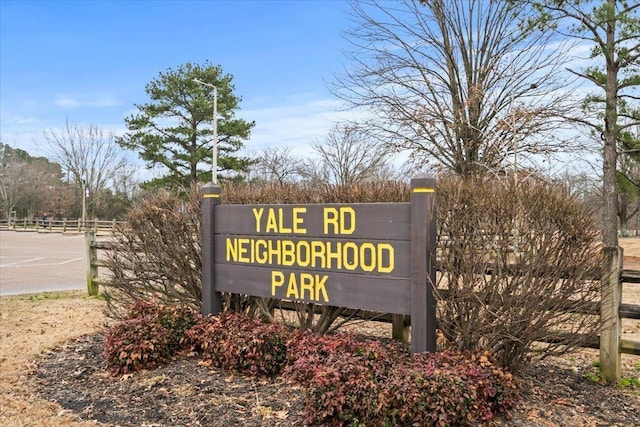 community sign with fence