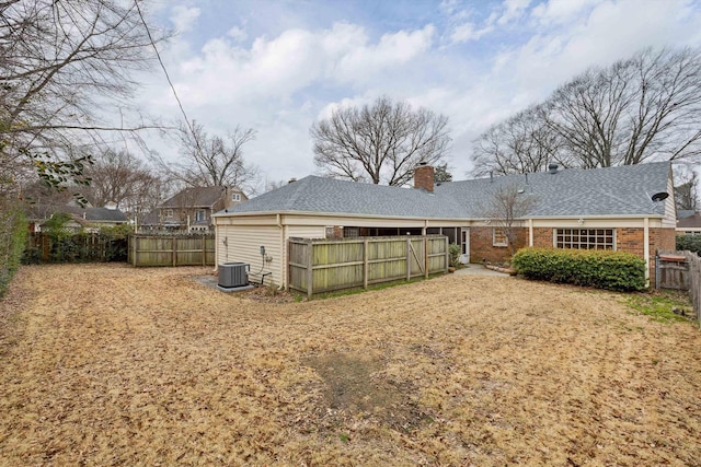 back of property with central air condition unit