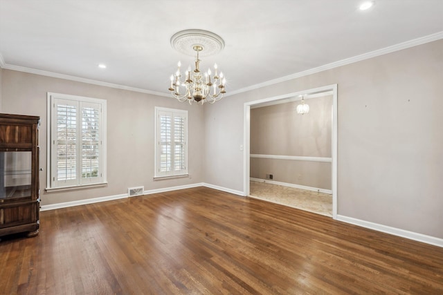 interior space with dark hardwood / wood-style flooring, a notable chandelier, and crown molding