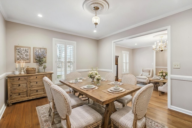 dining room featuring crown molding and wood-type flooring