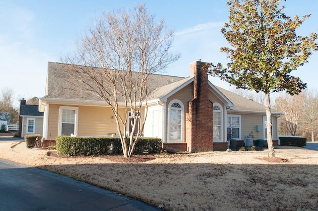 view of front of home featuring cooling unit