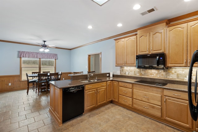 kitchen featuring ceiling fan, kitchen peninsula, sink, and black appliances