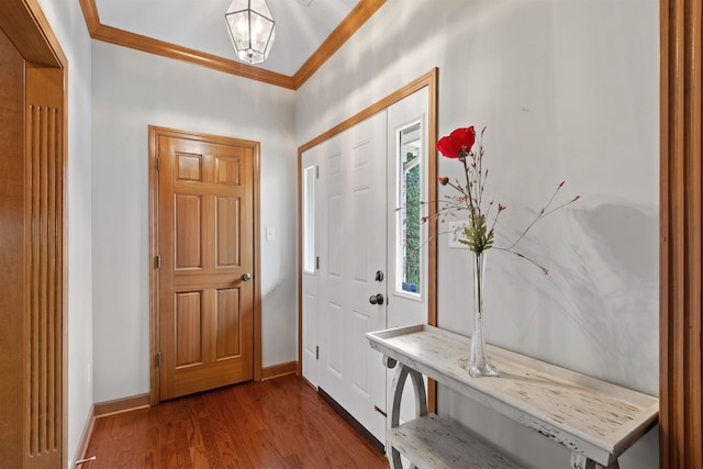 foyer with hardwood / wood-style floors and crown molding