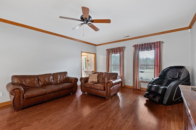 living room with dark wood-type flooring, ornamental molding, and ceiling fan