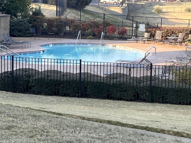 view of swimming pool with a patio