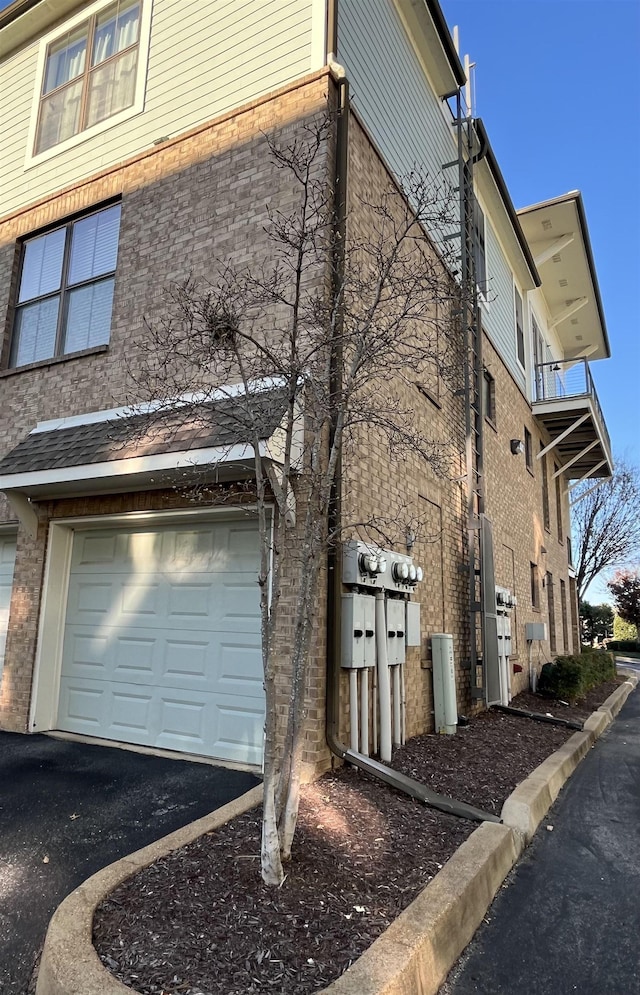 view of property exterior with a garage