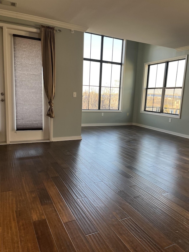 unfurnished room with dark wood-type flooring