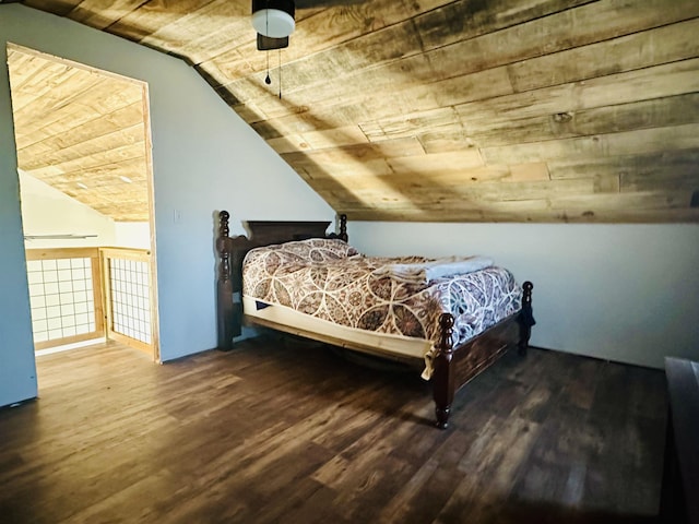 bedroom featuring vaulted ceiling, hardwood / wood-style floors, and wooden ceiling