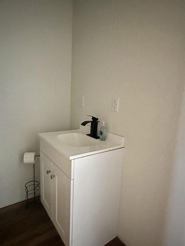 bathroom featuring vanity and wood-type flooring