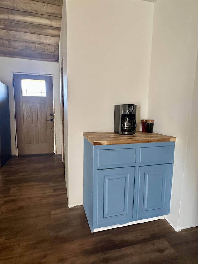 interior space with wooden counters and dark hardwood / wood-style flooring