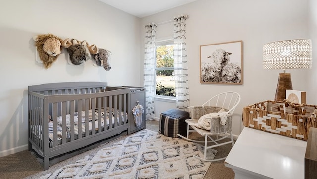 carpeted bedroom with a crib