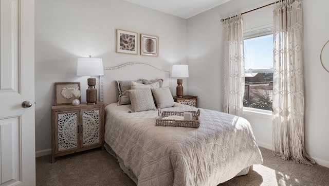 bedroom with multiple windows and carpet floors