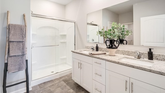 bathroom featuring vanity and walk in shower