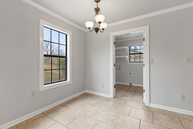 empty room featuring an inviting chandelier and ornamental molding