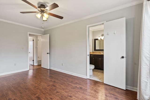 unfurnished bedroom with crown molding, wood-type flooring, ceiling fan, and ensuite bathroom