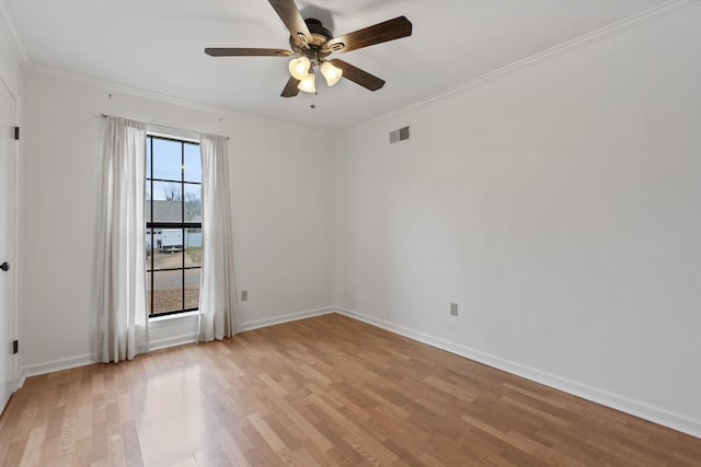 empty room with crown molding, ceiling fan, and light wood-type flooring