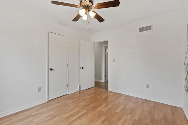 unfurnished bedroom featuring crown molding, light hardwood / wood-style floors, and ceiling fan