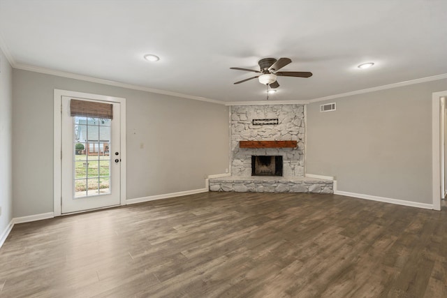 unfurnished living room featuring crown molding, dark hardwood / wood-style flooring, ceiling fan, and a fireplace