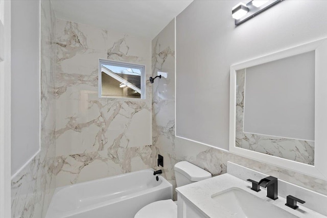 full bathroom featuring vanity, tiled shower / bath combo, tile walls, and toilet