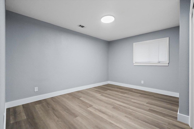 empty room featuring hardwood / wood-style floors