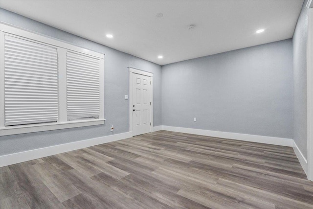 unfurnished room featuring wood-type flooring