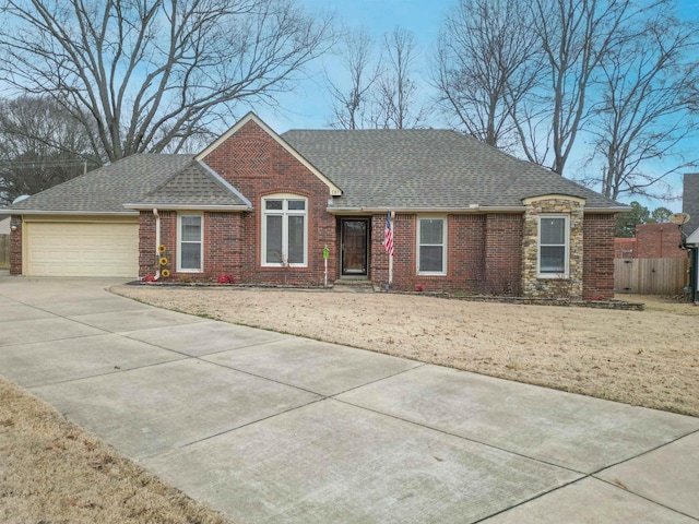 single story home with a garage and a front yard