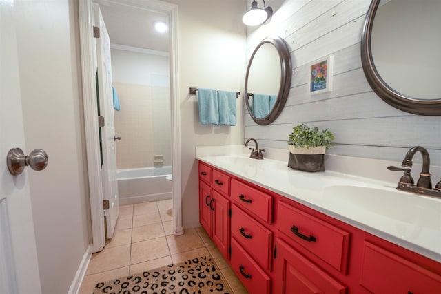 bathroom with vanity, tile patterned floors, and tiled shower / bath