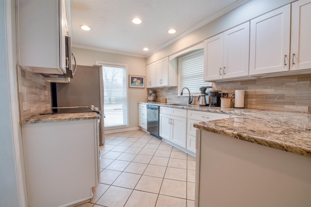 kitchen featuring dishwasher, sink, white cabinets, light tile patterned floors, and light stone countertops