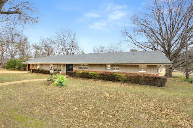 ranch-style home featuring a front yard