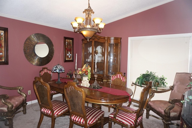 carpeted dining room featuring a notable chandelier, crown molding, and vaulted ceiling