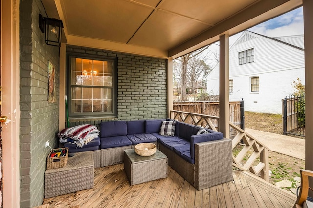 wooden deck featuring outdoor lounge area