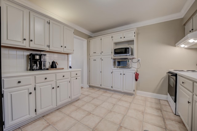 kitchen with stainless steel microwave, electric range oven, and white cabinetry