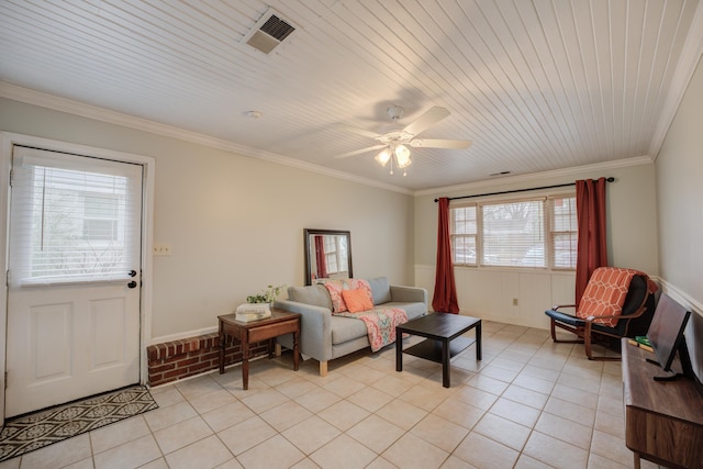 tiled living room featuring ceiling fan and ornamental molding