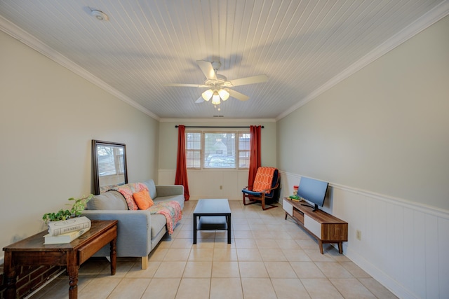 tiled living room featuring crown molding and ceiling fan