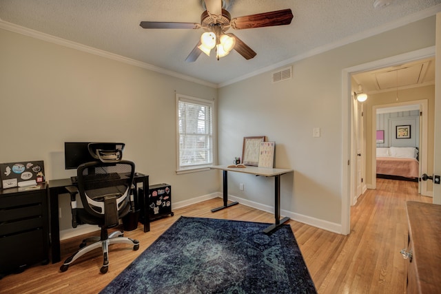 home office with crown molding, ceiling fan, a textured ceiling, and light hardwood / wood-style floors