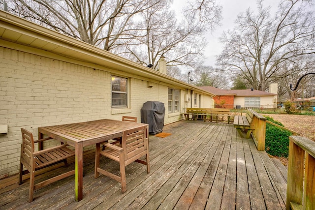 wooden deck featuring area for grilling