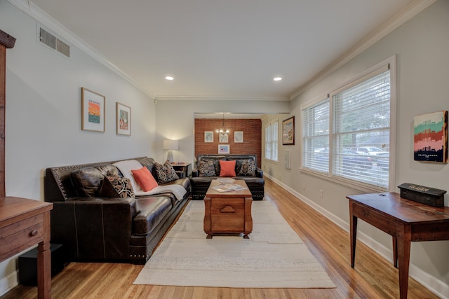 living room with crown molding and light hardwood / wood-style flooring