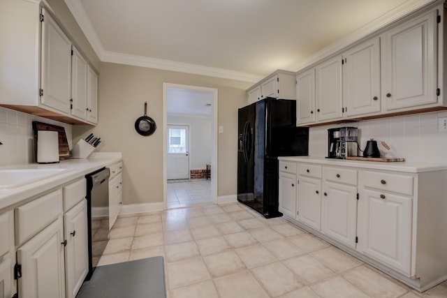 kitchen with white cabinetry, sink, and black appliances