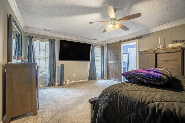 carpeted bedroom featuring crown molding, a barn door, ceiling fan, and a textured ceiling