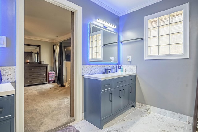 bathroom with vanity and ornamental molding