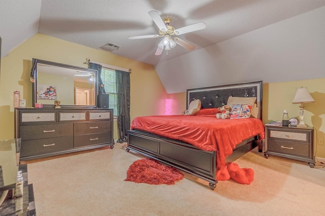 bedroom with lofted ceiling, light colored carpet, and ceiling fan