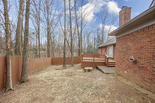 view of yard featuring a wooden deck