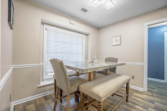 dining area with dark wood-type flooring