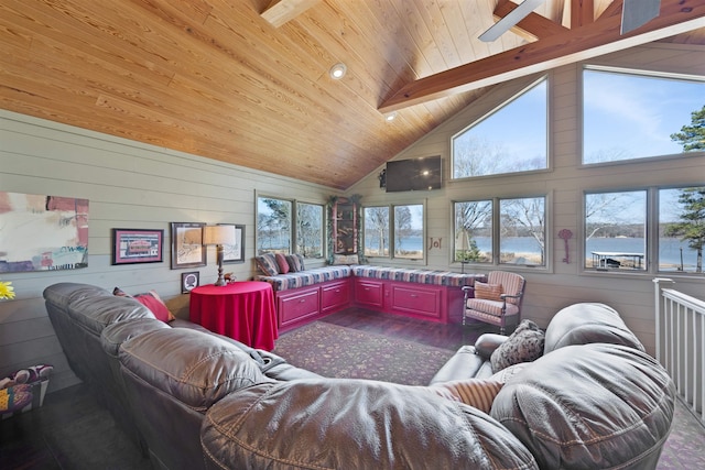 living room featuring hardwood / wood-style floors, high vaulted ceiling, wood walls, wood ceiling, and beam ceiling