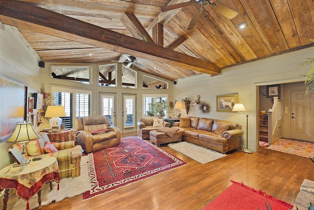 living room featuring wood ceiling, wood-type flooring, beamed ceiling, and ceiling fan