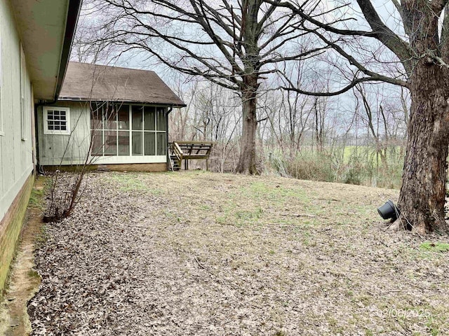 view of yard with a sunroom