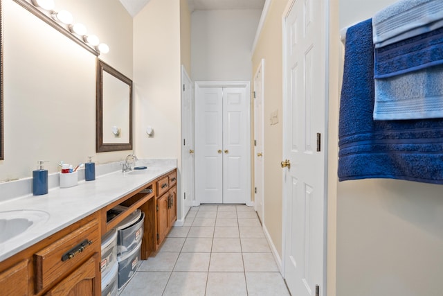 bathroom with tile patterned floors and vanity