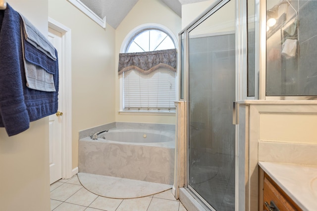 bathroom with lofted ceiling, vanity, separate shower and tub, tile patterned floors, and a textured ceiling